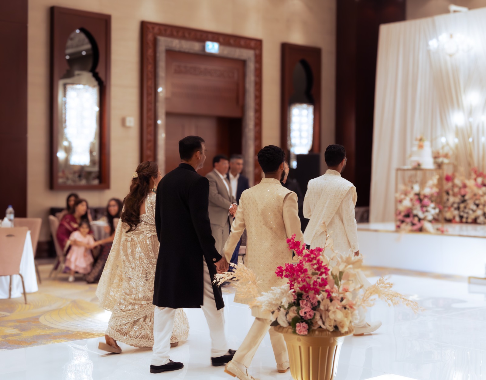 Bride walking through a ceremony space