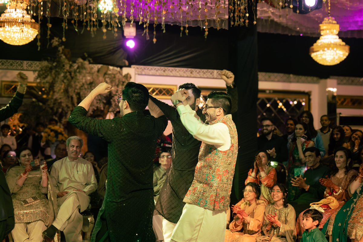 Wedding guests dancing during a sangeet celebration